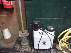 Sixteen litre knapsack sprayer and post hole tool.