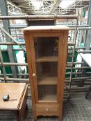 Pine cabinet with glazed door and drawer beneath