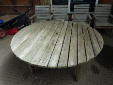 Large circular garden table and four wooden armchairs