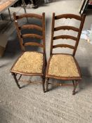 Two mahogany ladder back chairs