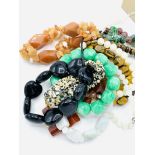 Twelve assorted gemstone bracelets