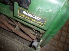 Qualcast Suffolk Punch 43S cylinder mower and a Mountfield electric scarifier.