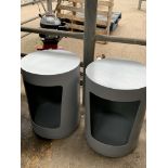 Two cylindrical side tables with integral storage