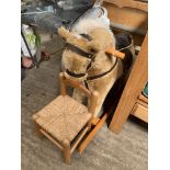 Child's small rocking horse by Mamma & Pappas and a child's string seat chair