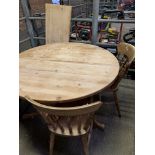 Circular pine extendable table with three pine Windsor style chairs