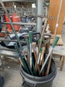 Plastic bin containing various garden tools