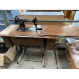 Singer sewing machine on cast iron treadle base