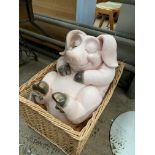 Humorous Pig figure in a wicker basket