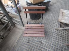 Six teak and black metal framed garden chairs