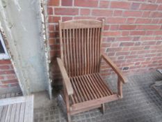 Four teak garden chairs