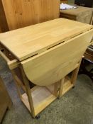 Laminated wood drop down gate leg table on casters