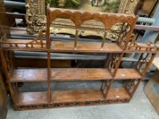 Mahogany fire screen, a teak tripod vase and a decorative shelf unit