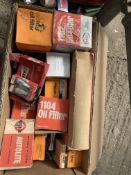 Large collection of car parts including air filters, oil filters and spark plugs