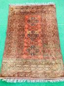 Red ground hand knotted rug