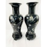 Two black lacquered wooden vases decorated with mother of pearl animals