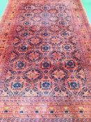 Dark red ground geometric pattern rug