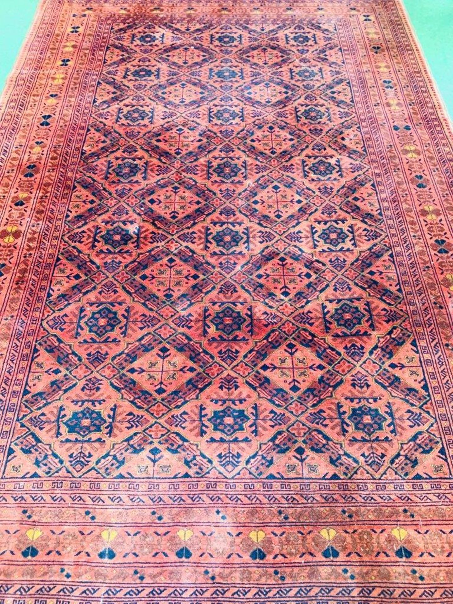 Dark red ground geometric pattern rug