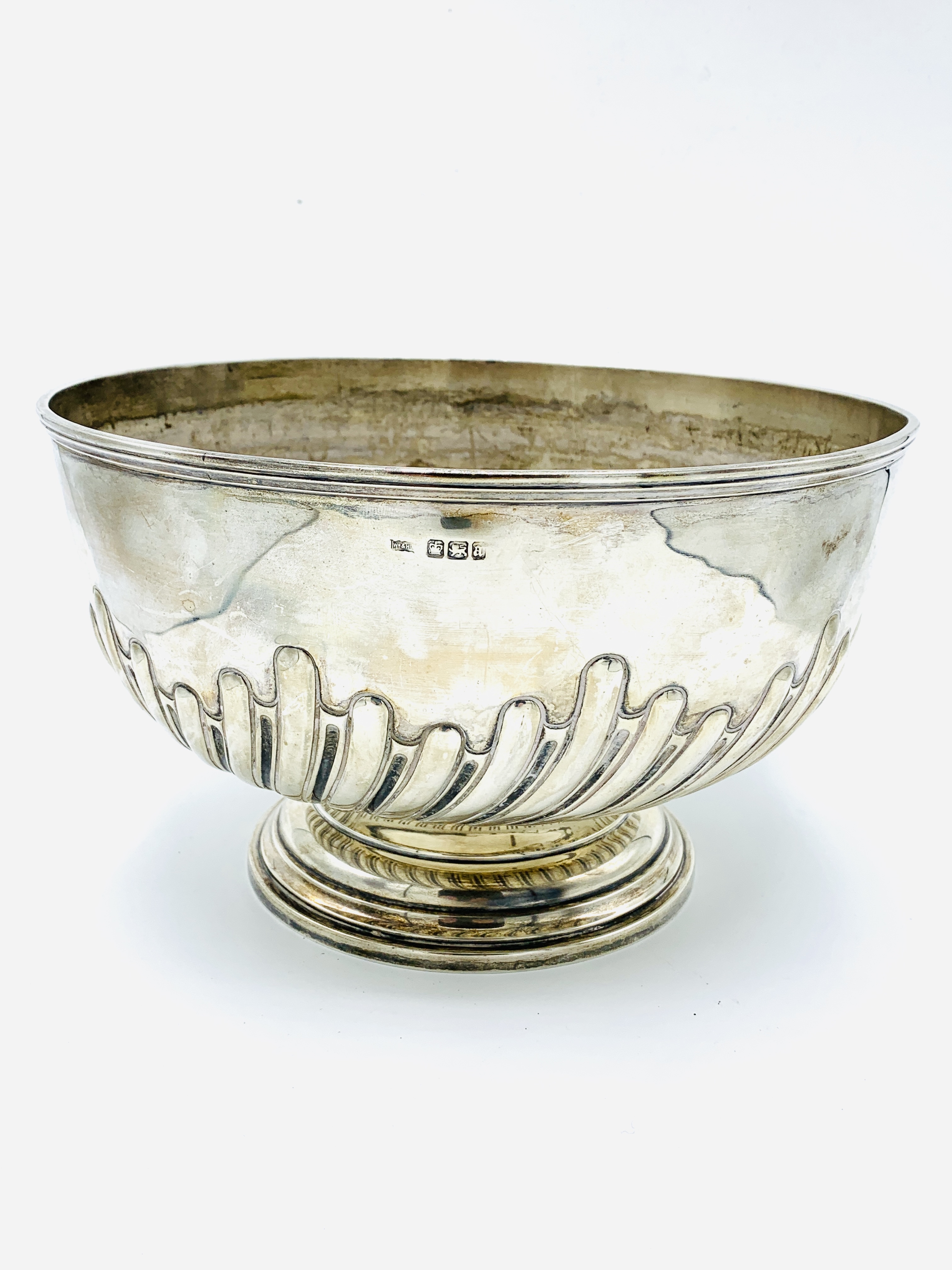 A silver rose bowl with repousse decoration, hallmarked Sheffield 1893