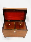 A mahogany sarcophagus shaped tea caddy and an oak box