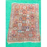 Small red ground hand knotted rug