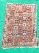 Small red ground hand knotted rug