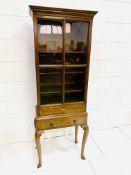 Inlaid mahogany bookcase on stand