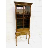 Inlaid mahogany bookcase on stand