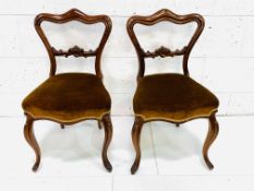 A pair of Victorian mahogany dining chairs