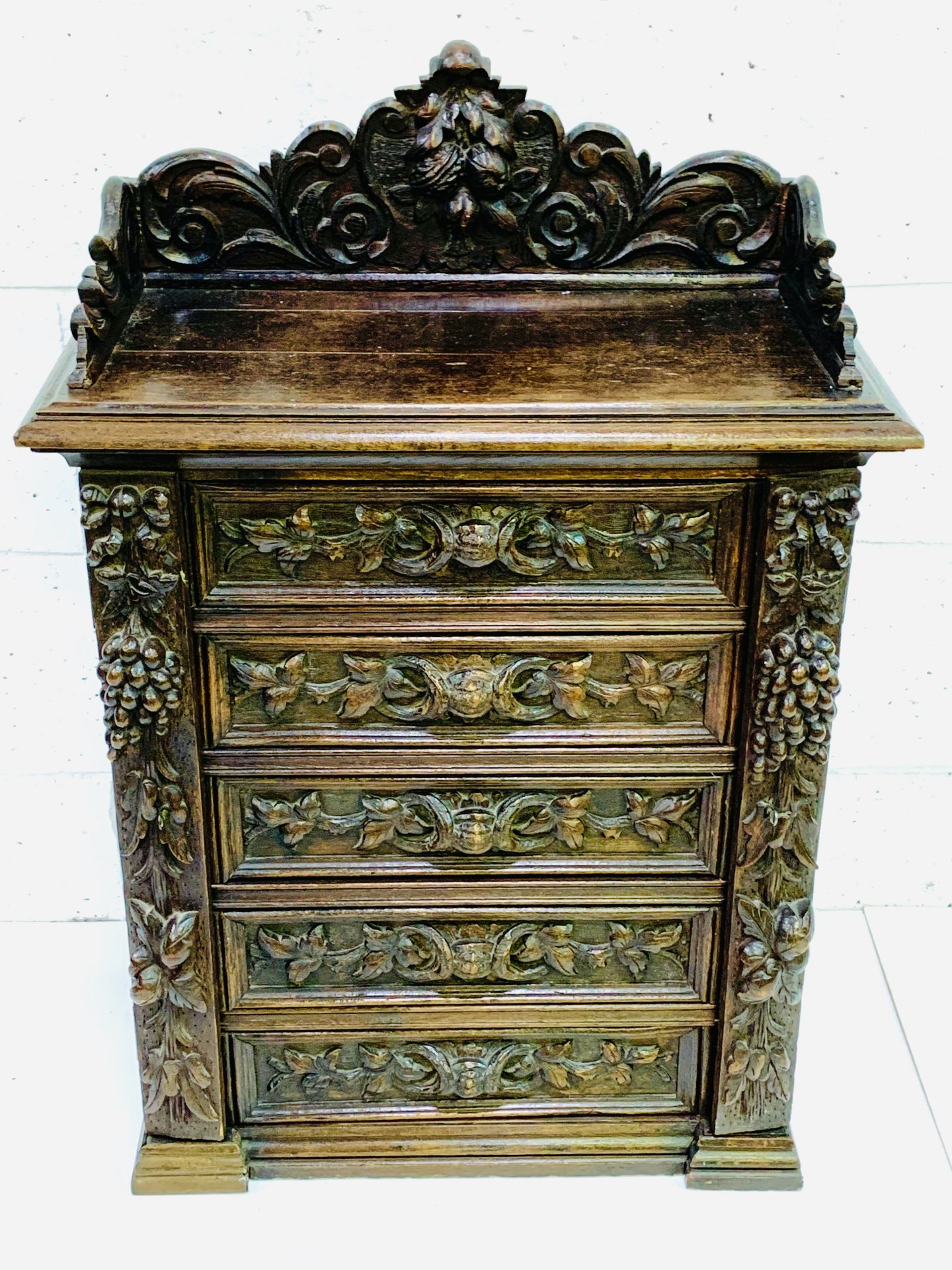Ornately carved Continental oak 5 drawer Wellington chest