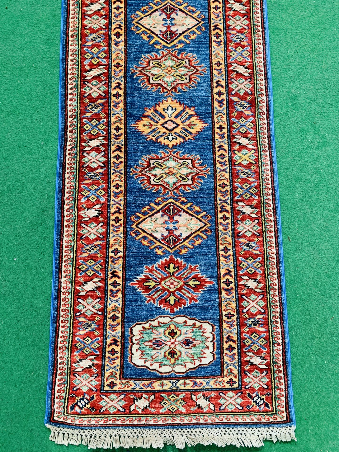 Blue ground Kazak runner and a red ground hand-knotted rug - Image 3 of 8