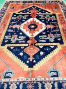 Blue and red ground South American patterned, hand knotted carpet