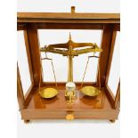 A set of brass balance scales to test 1lb by De Grave, Short and Co Ltd, London