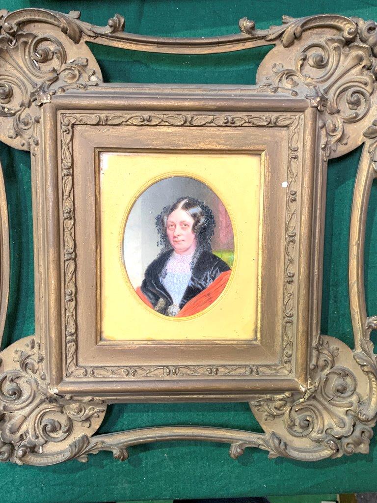 A small oil portrait of a Victorian lady in a very ornate gilt and glazed frame