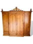 Large four door early 20th Century oak wardrobe cum linen press