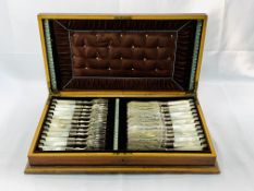 Silk lined walnut box containing a set of 12 fish knives and forks