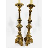 A pair of gilt and blue turned wood candle holder style table lamps