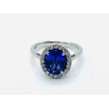 Tanzanite ring with a halo of diamonds