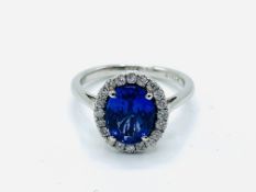 Tanzanite ring with a halo of diamonds