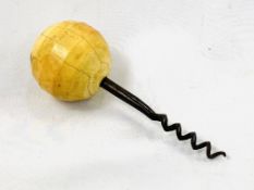 A late 18th/early 19th century metal corkscrew with turned ball shaped ivory handle