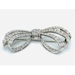 18ct white gold brilliant and baguette cut diamond openwork bow brooch.