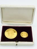 A boxed set of two gold Winston Churchill medallions commemorating the centenary of his birth.