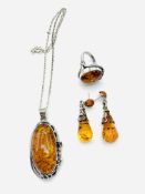 Amber and white metal necklace