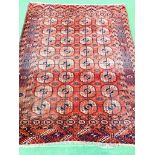 Red ground hand knotted rug