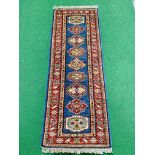 Blue ground Kazak runner and a red ground hand-knotted rug