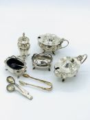 Silver cruet set of two lidded pots and a pepper shaker, together with other silver items.