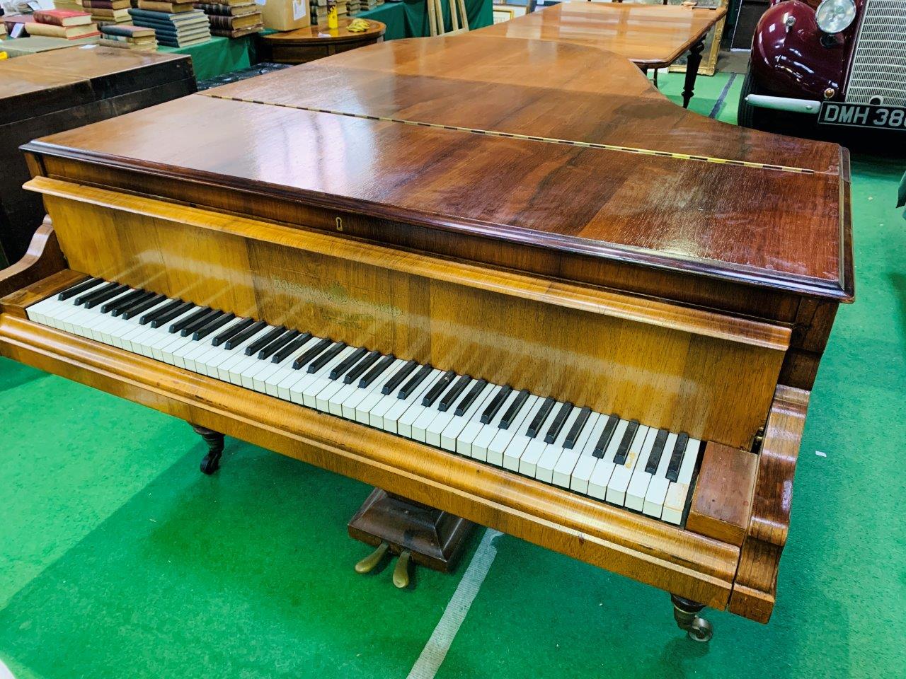 A mahogany cased small grand piano by Hagspiel & Company