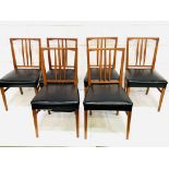 A group of 6 teak framed rail back chairs