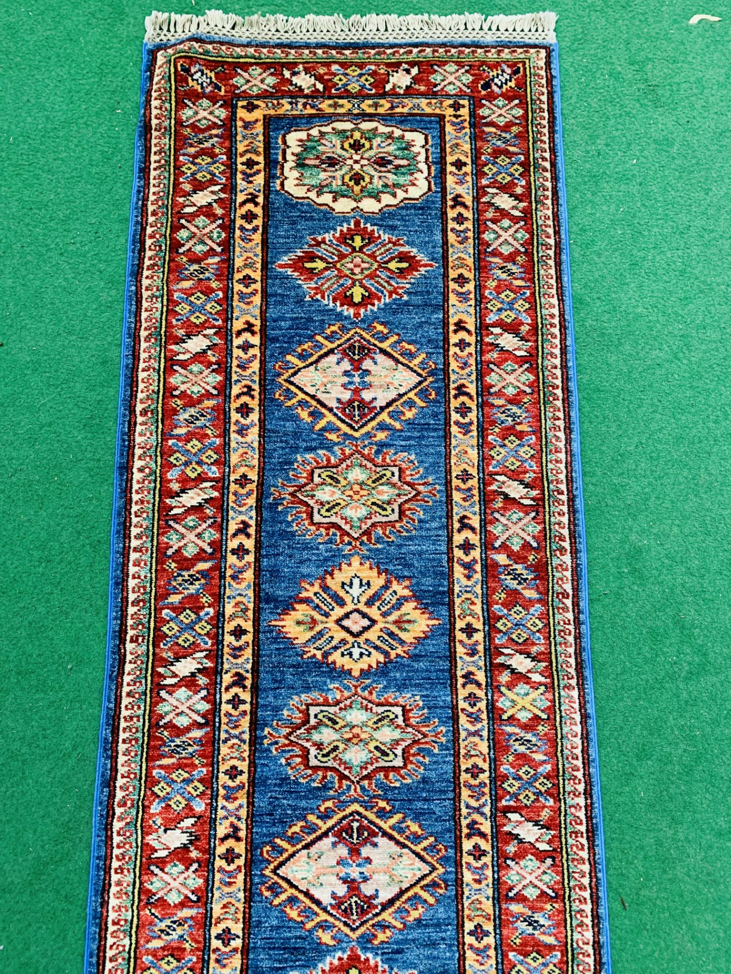 Blue ground Kazak runner and a red ground hand-knotted rug - Image 2 of 8