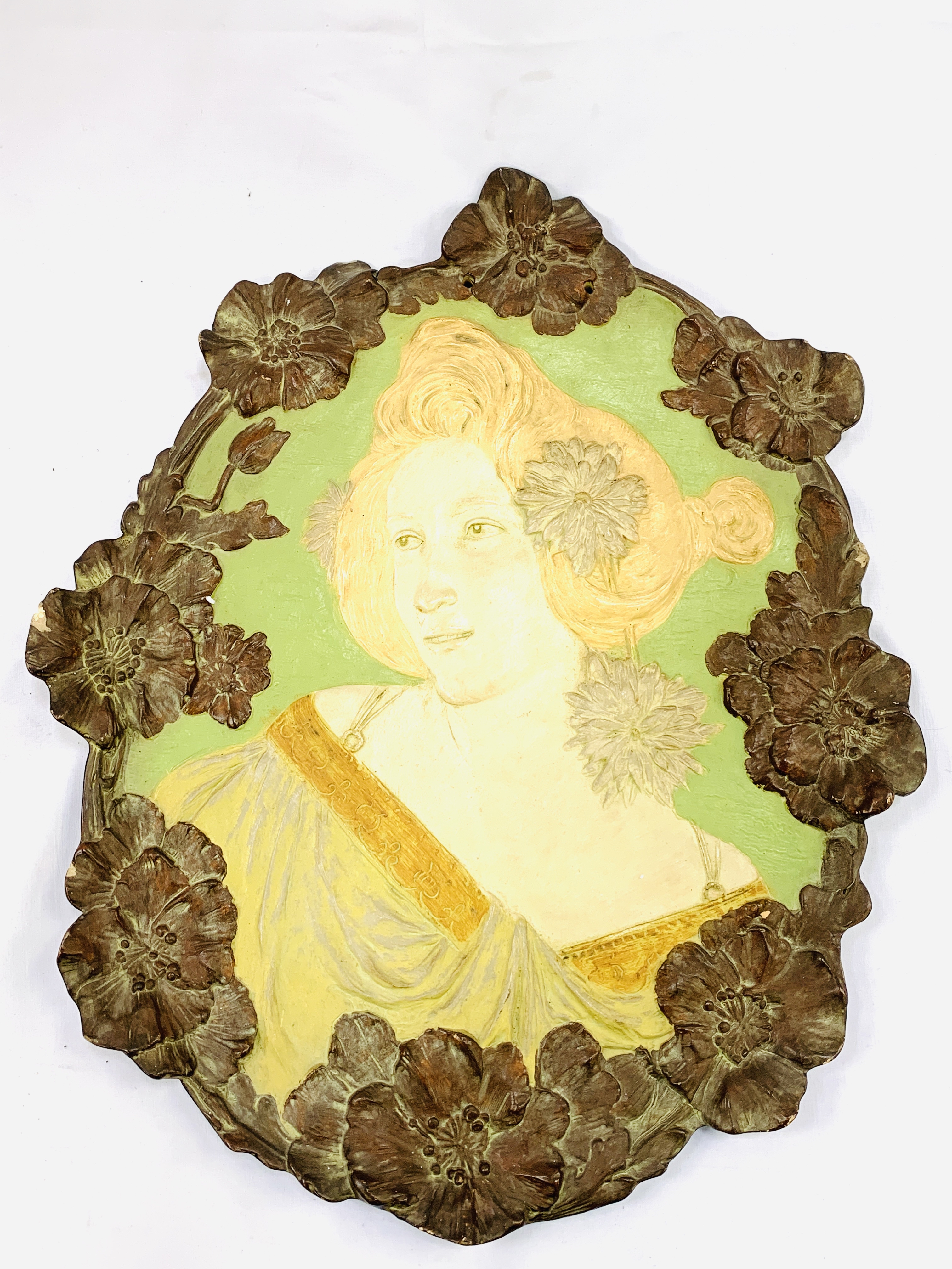 Art Nouveau wall plaque of a lady's head and shoulders, stamped 'Made in Austria, Ernst Wahliss'