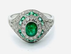 Platinum emerald and diamond ring